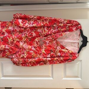 Orange and red in color flowery dress.